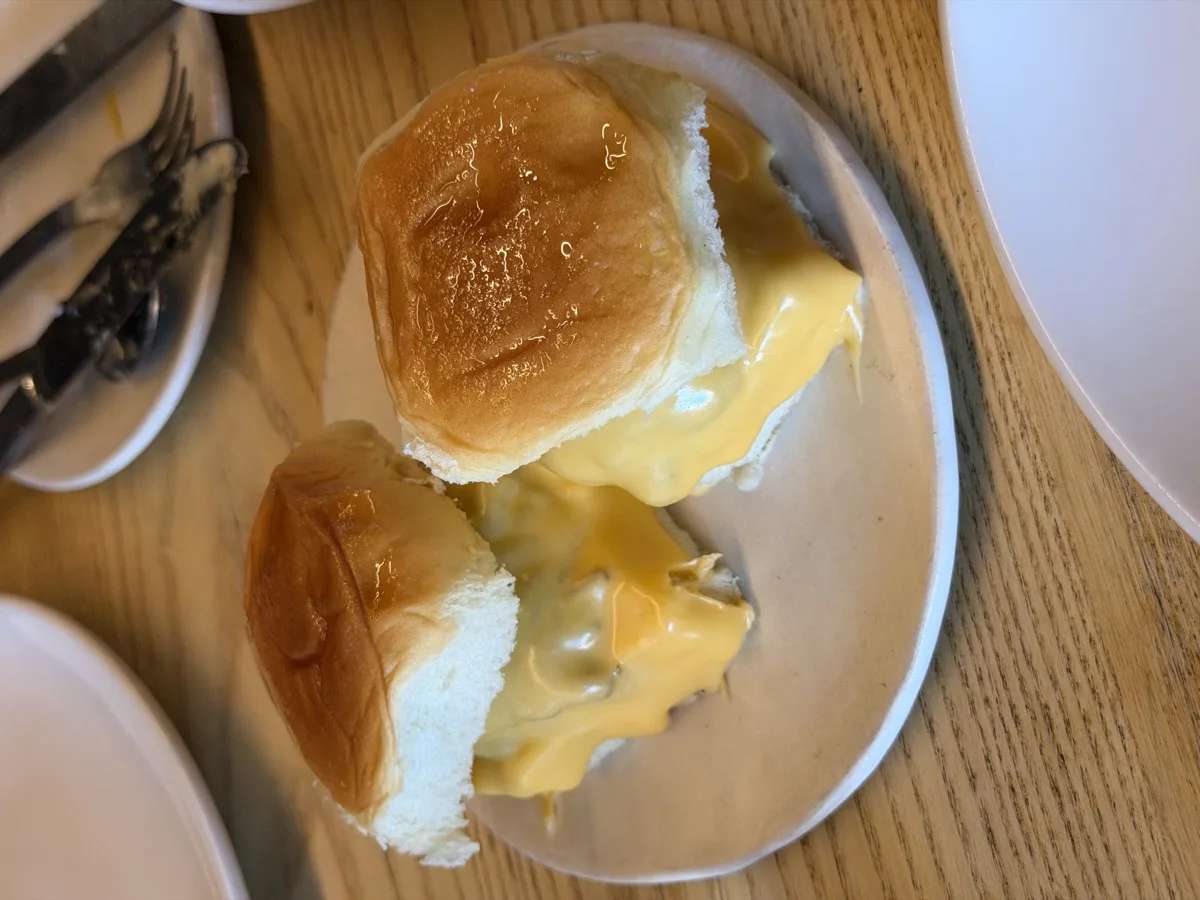 Dry-aged steam burgers with caramelized onion and American cheese